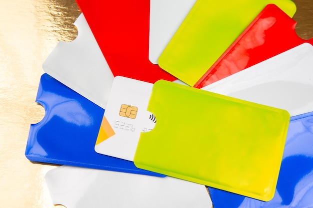 A close-up of various credit cards arranged to highlight their different designs and reward categories symbols, emphasizing cash back offers.