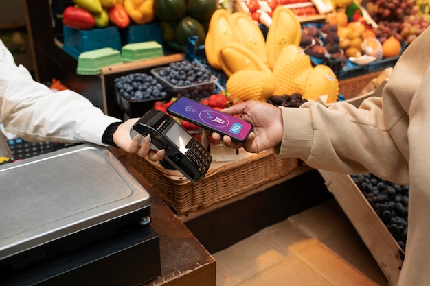 A person using a credit card to pay for groceries at a self-checkout, emphasizing strategic planning and maximizing benefits.