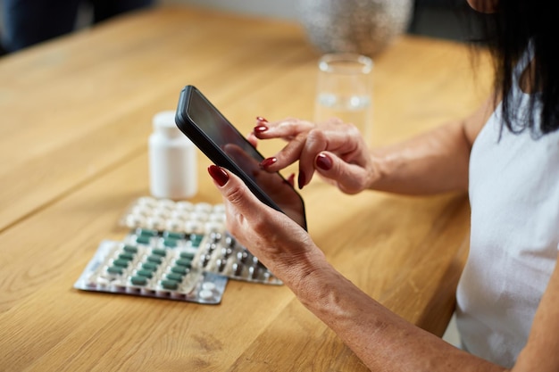 A person comparing prescription drug prices on a smartphone app, illustrating the potential cost savings.