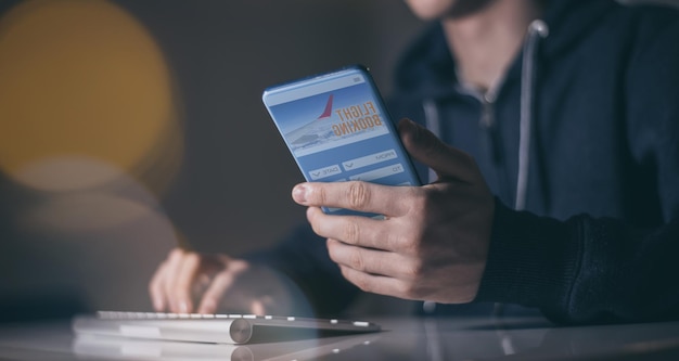 A person using a mobile banking app on their phone, with a low balance alert displayed prominently on the screen, emphasizing the importance of monitoring your account.