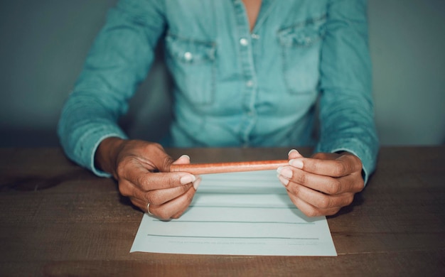 A close-up image of a hand signing an unemployment benefits application form, with a highlight on the section detailing eligibility requirements. The image should convey the importance of understanding the criteria.