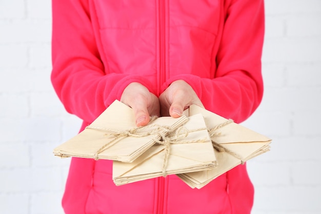 A split image showing cash being donated on one side and goods like clothing and household items being donated on the other, with a tax form overlayed, illustrating the different types of deductible donations.