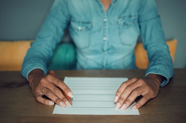 A close-up shot of a person filling out an application form with the company logo subtly visible, emphasizing the process of applying for tuition reimbursement.