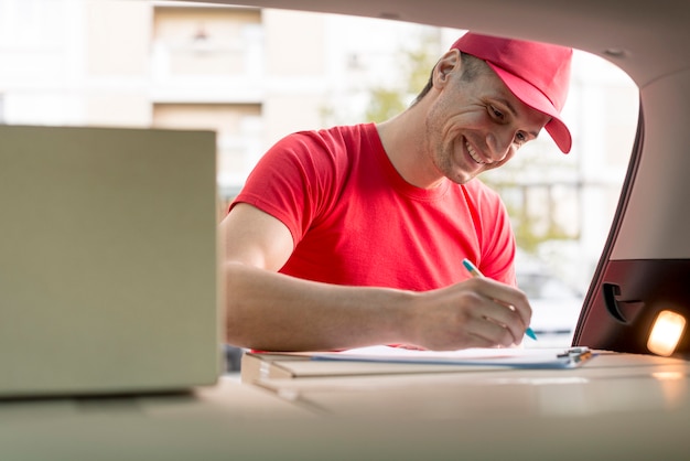 A person happily submitting enrollment forms online, symbolizing the ease of enrolling in an HRA.