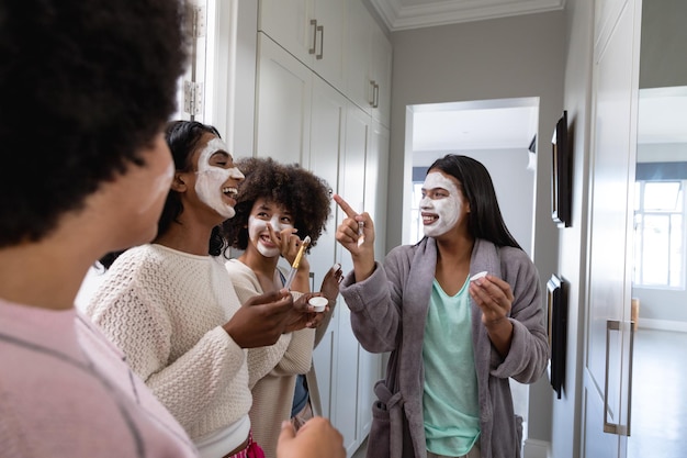 A diverse group of people touring a model home with a sales representative. The image should convey a sense of optimism and the excitement of buying a new home.
