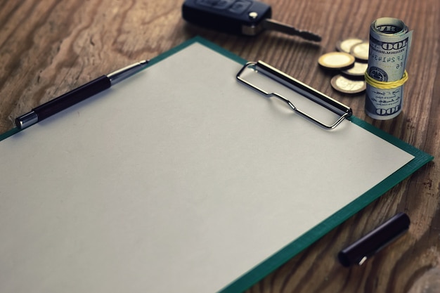 A close-up of a pen signing a loan agreement, with fine print visible in the background. The image should focus on the details of the agreement and the potential for exploitation.